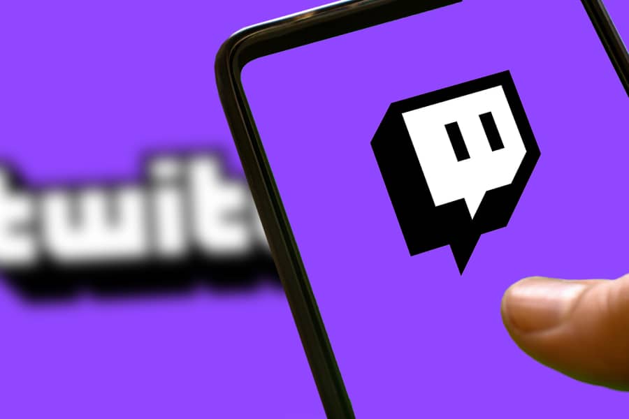 Twitch logo on mobile phone and computer screen